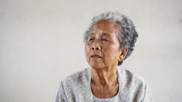 Happy Asian Grandmother on white background