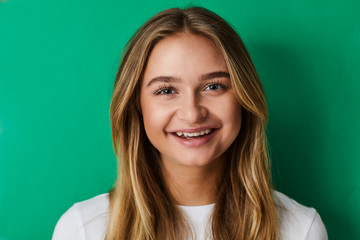 Smiling girl on green, portrait