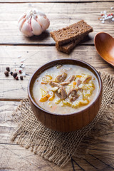 Kharcho soup with meat and rice on wooden table