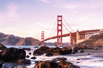 Panoramic sunset view on Golden Gate bridge from Marshal's beach. San Francisco, California.