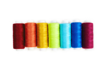 Colored sewing thread isolated on white background