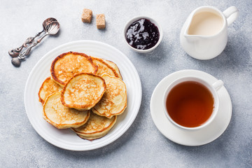 Cottage cheese pancakes with jam and tea. Concept healthy Breakfast.