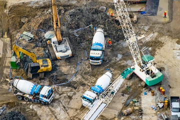 Aerial view of site preparation and construction in progress.