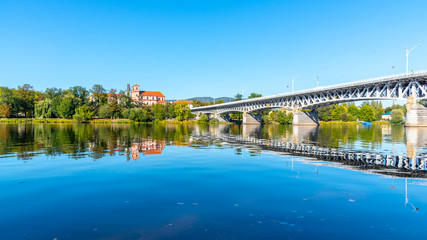 Panoramic cityscape of Litomerice reflected in Labe River, Czech Republic.