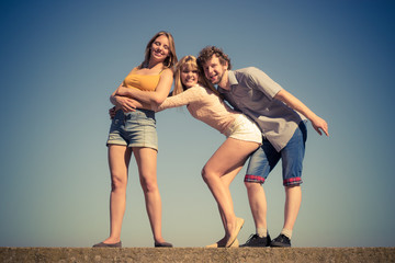 Group friends boy two girls having fun outdoor