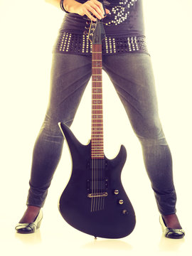 Blonde girl with electric guitar.