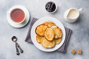 Cottage cheese pancakes with jam and tea. Concept healthy Breakfast.