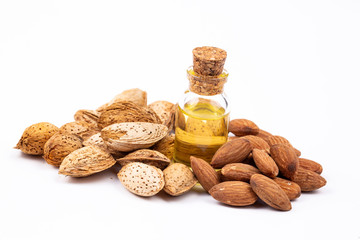 Almond oil on the white background. Organic herbal oil.