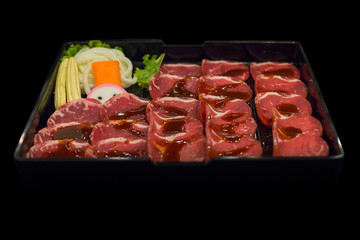 Fresh raw sliced pork in black background, selective focus