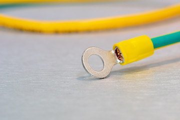 Electric ground cables with insulated ring terminal lug
