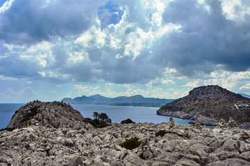 Fototapeta na wymiar rocky cliff at the edge of the Mediterranean Sea, on the island of Rhodes