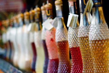 Bottles with colorful  liqueur and nice bokeh