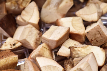 Sliced fresh mushrooms boletus in bowls close-up