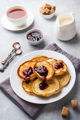 Cottage cheese pancakes with jam and tea. Concept healthy Breakfast.