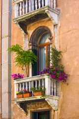 Windows on the old building in Venice canal, Italy