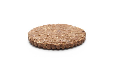 Integral oatmeal cookie with chocolate isolated on white background