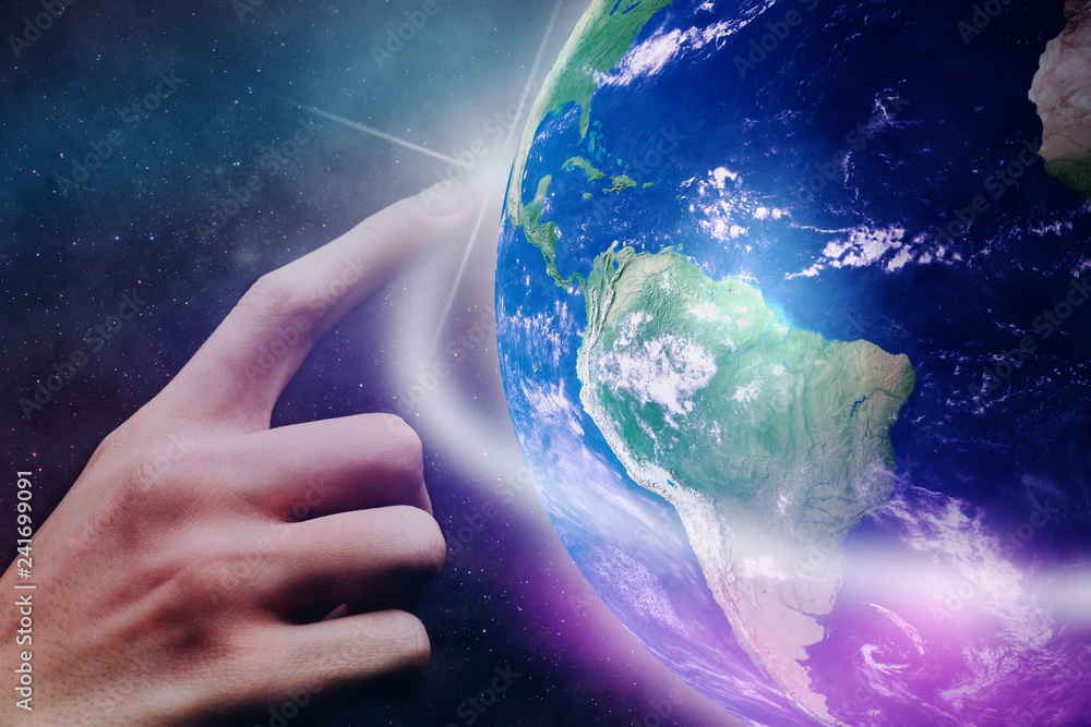 Leinwandbilder touching planet with finger. nebula dust in infinite space. mixed media.