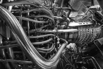 Gas turbine engine of feed gas compressor located inside pressurized enclosure, Black white...