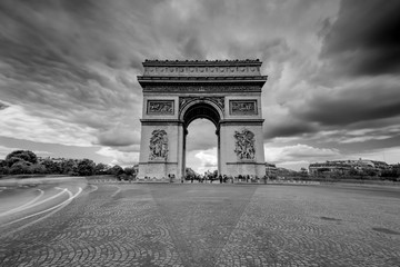 Fototapeta na wymiar Dark Clouds coming over the Arc de Triomphe in Paris, France