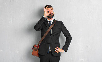 Businessman with beard makes funny and crazy face emotion