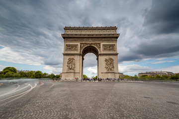 Obraz na płótnie Canvas Dark Clouds coming over the Arc de Triomphe in Paris, France