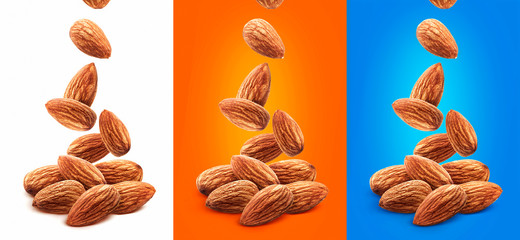 Falling almond nuts isolated on white background