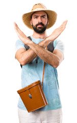 Funny tourist making NO gesture on isolated white background