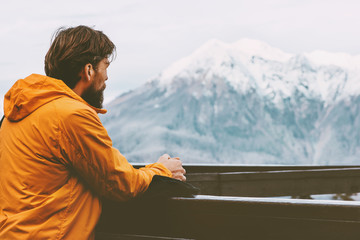 Traveler man enjoying mountains view adventure lifestyle traveling winter vacations outdoor...