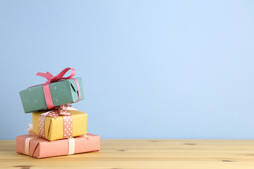 Many gift box on wooden table. Christmas or birthday concept