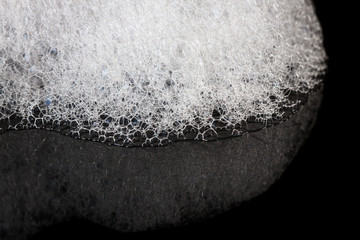 Foam bubbles abstract black background. Detergent