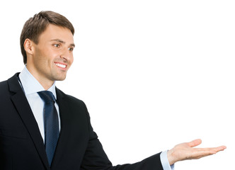 Businessman showing blank area for sign or copyspase