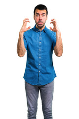 Handsome man with blue shirt  annoyed and angry in furious gesture