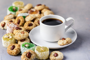 Cup of Coffee and Tasty Turkish Delight Oriental Dessert Lokum and Oriental Cookies Close Up