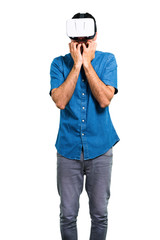 Handsome man with blue shirt using VR glasses