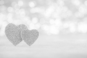 Silver heart bokeh background, valentine day greeting card.