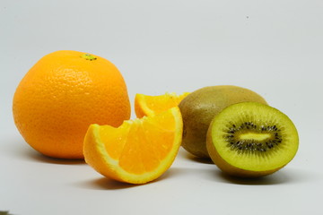 Kiwi and orange fruit isolated on white background