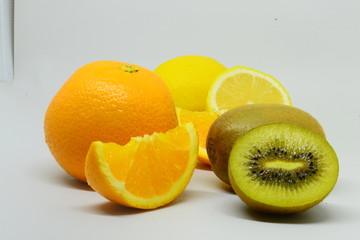 Kiwi and orange fruit isolated on white background