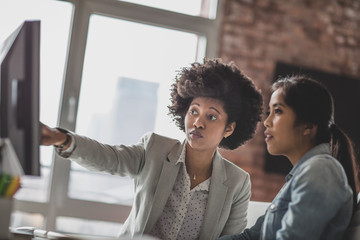 Business manager training an employee