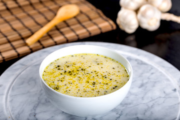 Traditional yayla soup (yoghurt soup) on wooden background