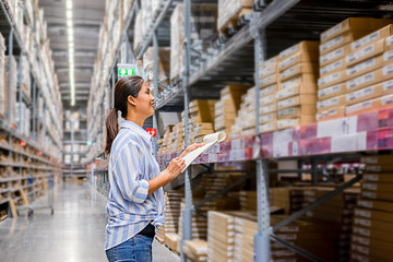 Asian woman with market trolley at furniture store