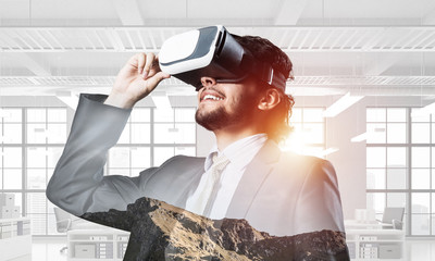 Handsome elegant businessman experiencing impressive virtual rea