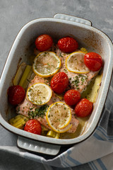 Oven baked salmon with leek and tomatoes.