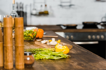 unprocessed cut vegetables on tabletop in kitchen