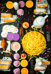 French fries with sweets and cocoa. Breakfast.
