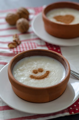 Delicious rice pudding with cinnamon in bowl, closeup