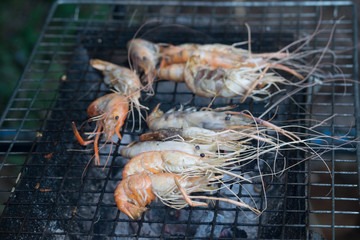 Grilled grilled on the grill with a hand holding the fork