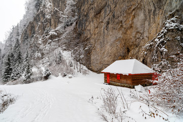 Wooden shelter or barn in the mountains during winter time