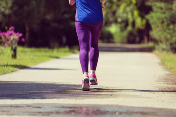 Fototapeta na wymiar young female runner training for marathon