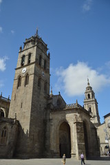 Fototapeta na wymiar Tower of the Cathedral of Santa María temple that holds the privilege of the permanent exhibition of the Blessed Sacrament In Lugo. Travel, Architecture, Holidays. August 3, 2015. Lugo Galicia Spain.