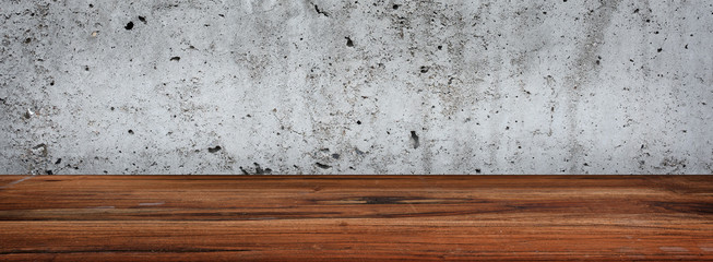 Concrete wall with wooden table
